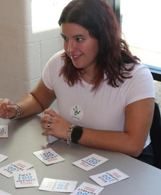 LECHS Student playing card game at table