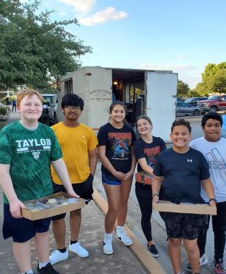 students volunteering with the Rotary Club